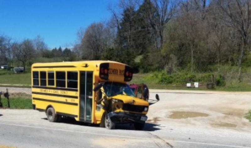 The school bus failed to yield making a left turn.