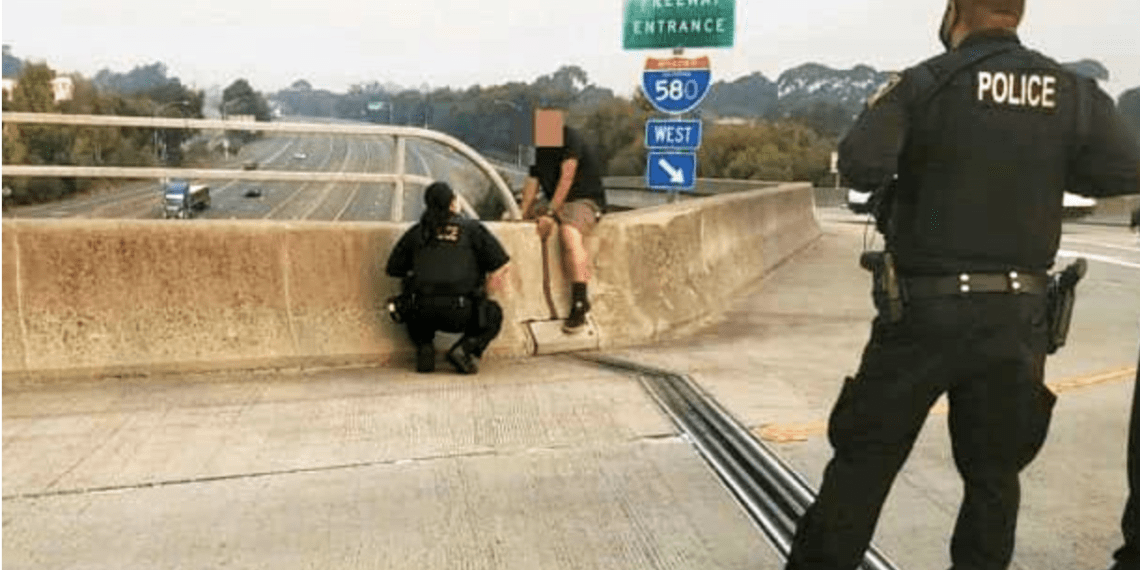 Police talk man from jumping off freeway overpass Law Officer